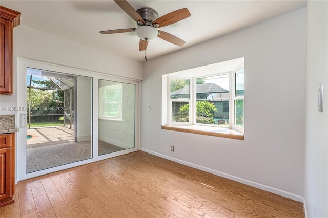 9919 SW 1st Ct, Coral Springs, FL 33071 - empty room featuring light wood-style floors, a ceiling fan, and baseboards