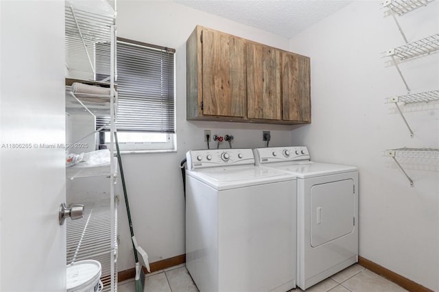9919 SW 1st Ct, Coral Springs, FL 33071 - washroom with cabinet space, independent washer and dryer, light tile patterned floors, and baseboards