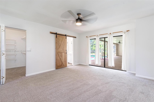 9919 SW 1st Ct, Coral Springs, FL 33071 - unfurnished bedroom with a barn door, carpet flooring, access to outside, and baseboards