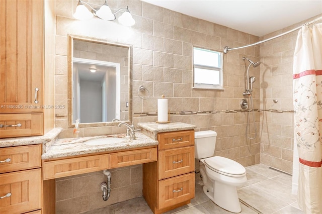9919 SW 1st Ct, Coral Springs, FL 33071 - bathroom featuring tile walls, toilet, tile patterned floors, tiled shower, and vanity