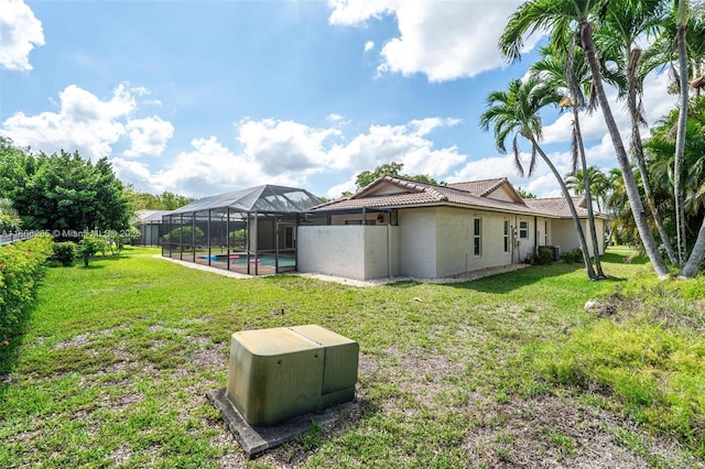 9919 SW 1st Ct, Coral Springs, FL 33071 - view of grassy yard featuring glass enclosure and central AC