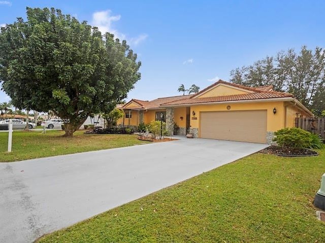15824 Cotswold Ct, Davie, FL 33331 - single story home featuring a garage, driveway, stucco siding, a tiled roof, and stone siding