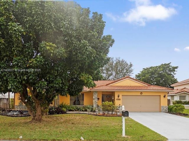 15824 Cotswold Ct, Davie, FL 33331 - view of front of property featuring a garage, stucco siding, a tile roof, a front yard, and concrete driveway