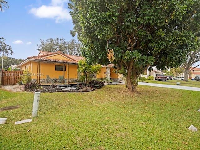 15824 Cotswold Ct, Davie, FL 33331 - view of front facade with a tiled roof and stucco siding