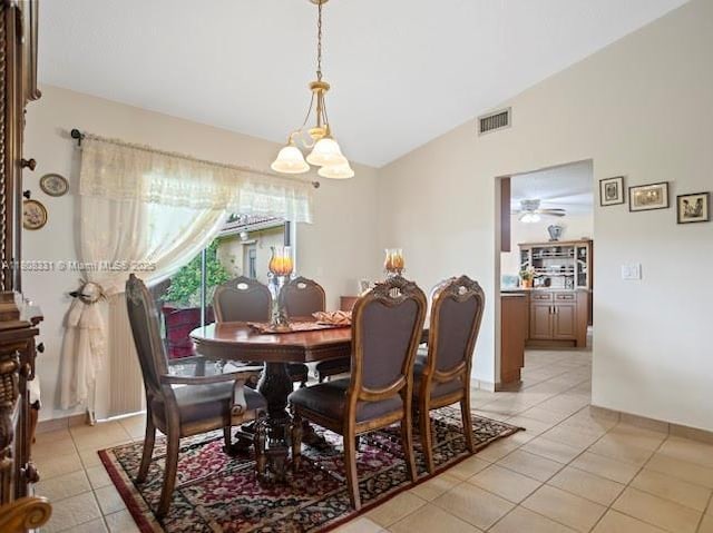 15824 Cotswold Ct, Davie, FL 33331 - dining space featuring lofted ceiling, light tile patterned floors, ceiling fan, a chandelier, and baseboards