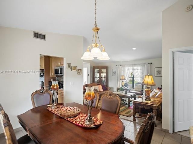 15824 Cotswold Ct, Davie, FL 33331 - dining space featuring light tile patterned floors and a chandelier
