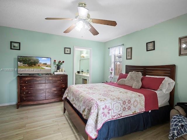 15824 Cotswold Ct, Davie, FL 33331 - bedroom with light wood-style floors, ceiling fan, and ensuite bath