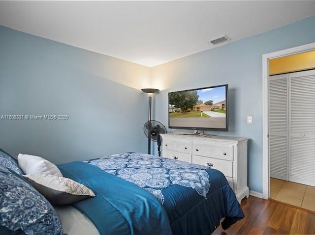 15824 Cotswold Ct, Davie, FL 33331 - bedroom featuring wood finished floors and baseboards