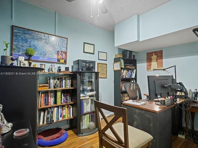 15824 Cotswold Ct, Davie, FL 33331 - home office featuring wood finished floors, ceiling fan, and a textured ceiling