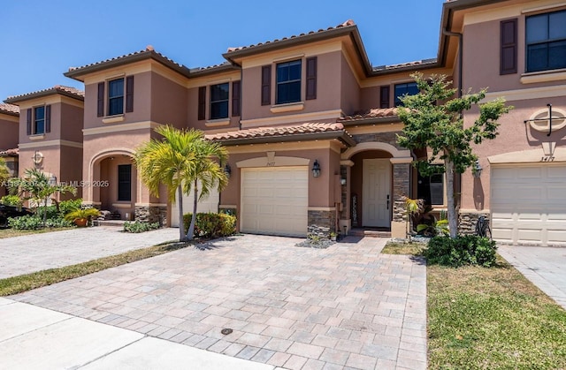 3427 W 89th Ter, Hialeah, FL 33018 - mediterranean / spanish house with stucco siding, a tiled roof, and a garage