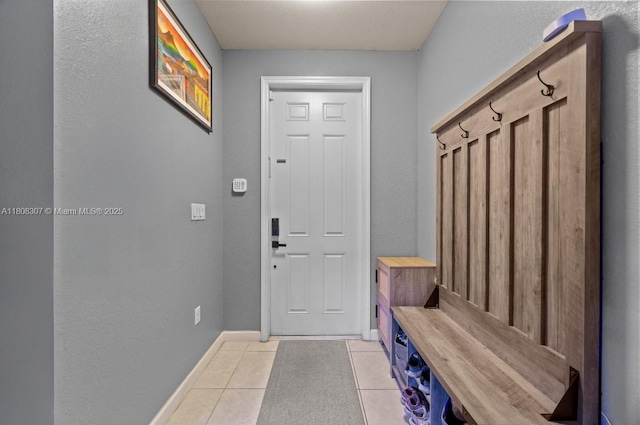3427 W 89th Ter, Hialeah, FL 33018 - mudroom with light tile patterned flooring and baseboards