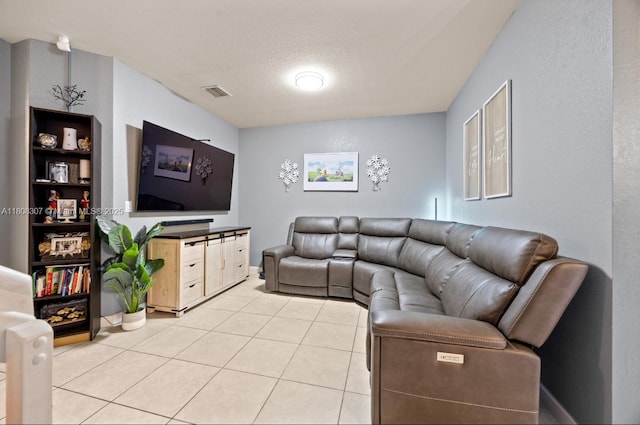 3427 W 89th Ter, Hialeah, FL 33018 - living room featuring light tile patterned floors, baseboards, and a textured ceiling