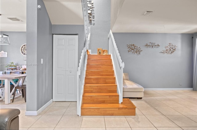 3427 W 89th Ter, Hialeah, FL 33018 - stairway with tile patterned floors and baseboards