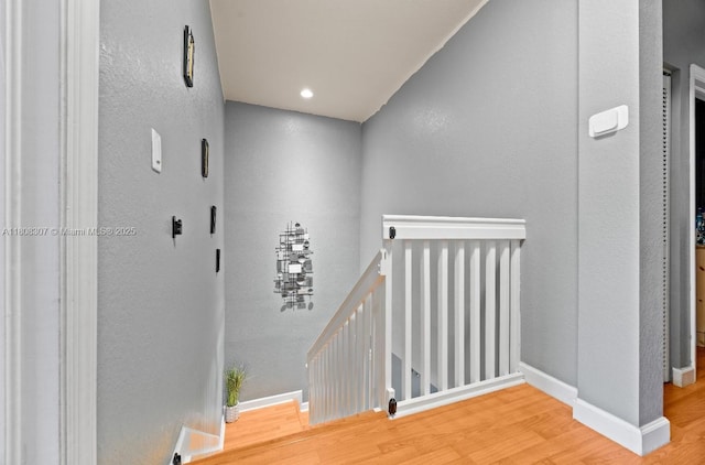 3427 W 89th Ter, Hialeah, FL 33018 - corridor featuring an upstairs landing, wood finished floors, and baseboards
