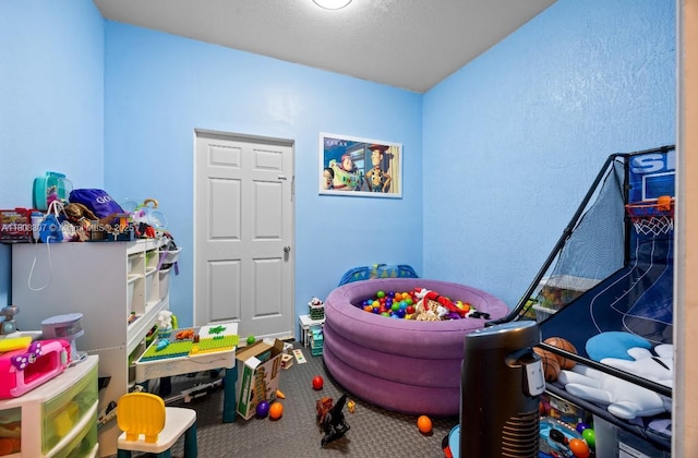 3427 W 89th Ter, Hialeah, FL 33018 - rec room featuring carpet flooring and a textured wall