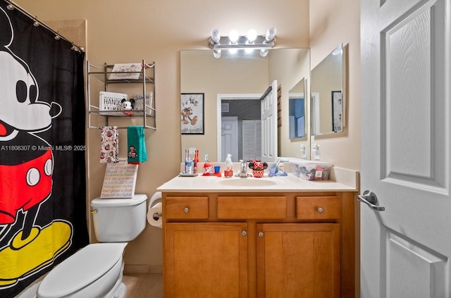 3427 W 89th Ter, Hialeah, FL 33018 - bathroom with toilet, vanity, a shower with curtain, and tile patterned flooring
