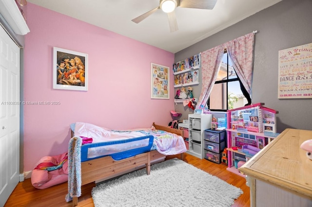 3427 W 89th Ter, Hialeah, FL 33018 - bedroom featuring wood finished floors, a closet, and ceiling fan