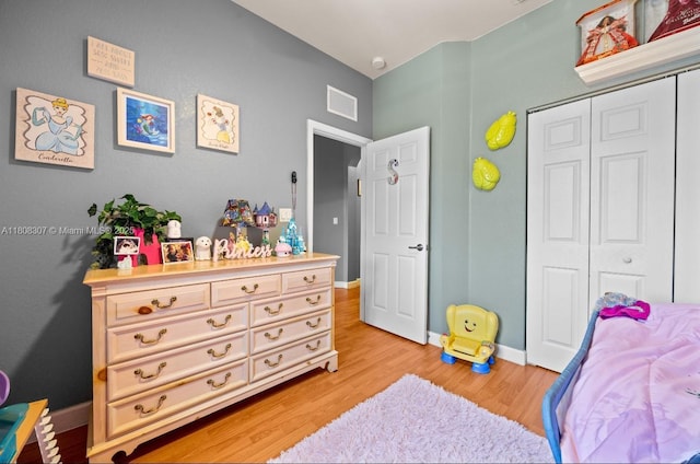 3427 W 89th Ter, Hialeah, FL 33018 - bedroom featuring light wood finished floors, a closet, and baseboards