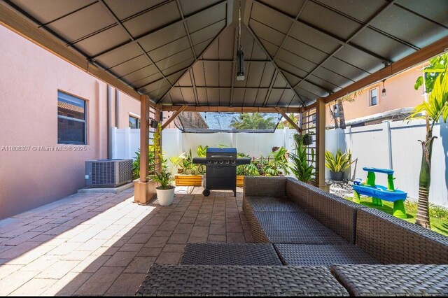 3427 W 89th Ter, Hialeah, FL 33018 - fenced backyard with a gazebo, area for grilling, and a patio