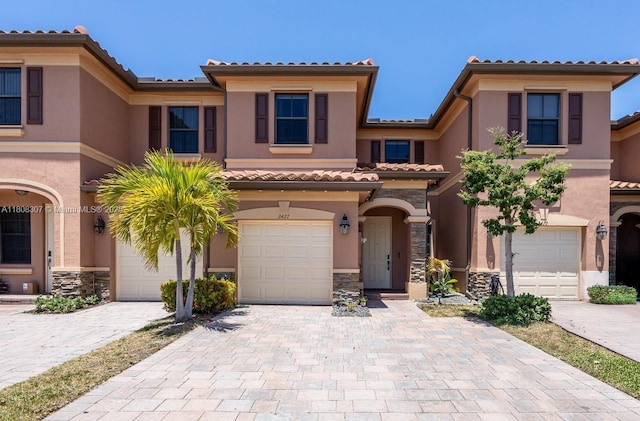 3427 W 89th Ter, Hialeah, FL 33018 - view of front of house featuring a tiled roof, stucco siding, and decorative driveway