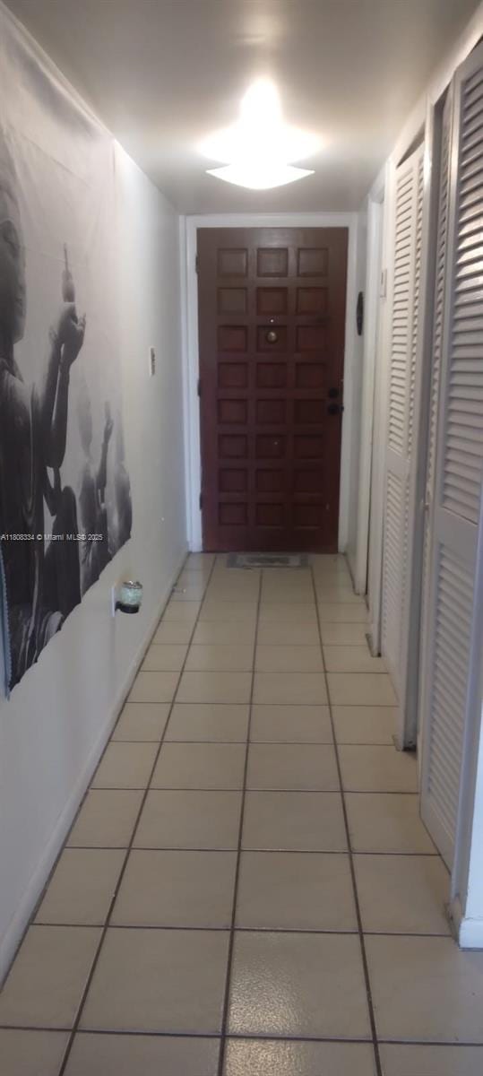 650 NE 149th St Unit 407A, Miami, FL 33161 - corridor featuring light tile patterned floors