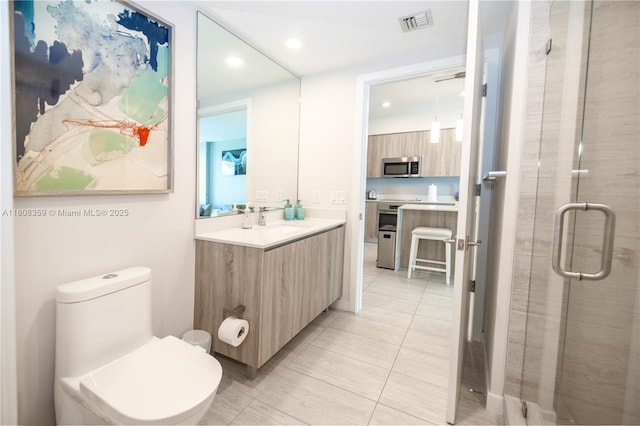 3900 Biscayne Blvd Unit S-1118, Miami, FL 33137 - bathroom with vanity, recessed lighting, tile patterned flooring, a shower stall, and toilet