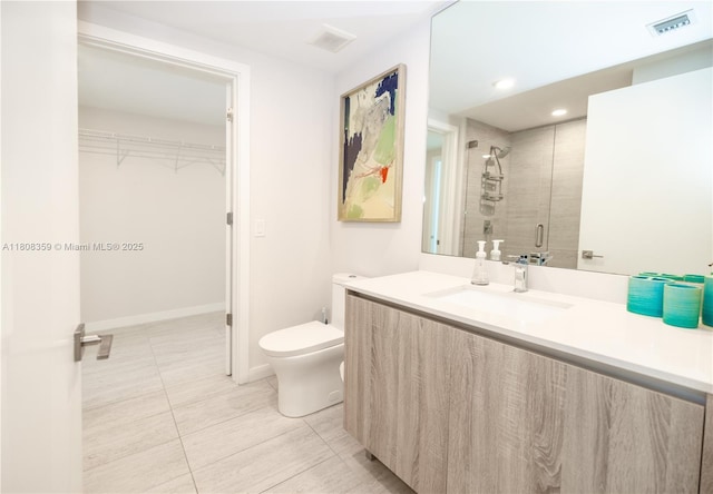 3900 Biscayne Blvd Unit S-1118, Miami, FL 33137 - bathroom featuring toilet, vanity, a stall shower, a spacious closet, and tile patterned floors