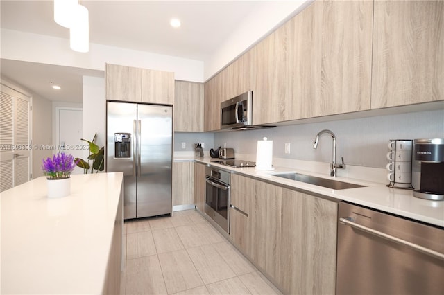 3900 Biscayne Blvd Unit S-1118, Miami, FL 33137 - kitchen featuring appliances with stainless steel finishes, modern cabinets, a sink, light brown cabinetry, and recessed lighting