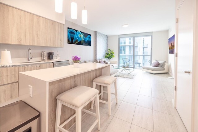3900 Biscayne Blvd Unit S-1118, Miami, FL 33137 - kitchen with light brown cabinets, modern cabinets, open floor plan, light countertops, and floor to ceiling windows