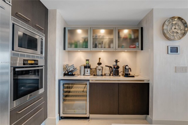 17001 Collins Ave Unit 2501, Sunny Isles Beach, FL 33160 - indoor bar featuring beverage cooler and appliances with stainless steel finishes