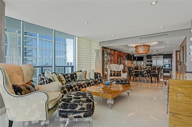 17001 Collins Ave Unit 2501, Sunny Isles Beach, FL 33160 - tiled living room featuring a raised ceiling and floor to ceiling windows