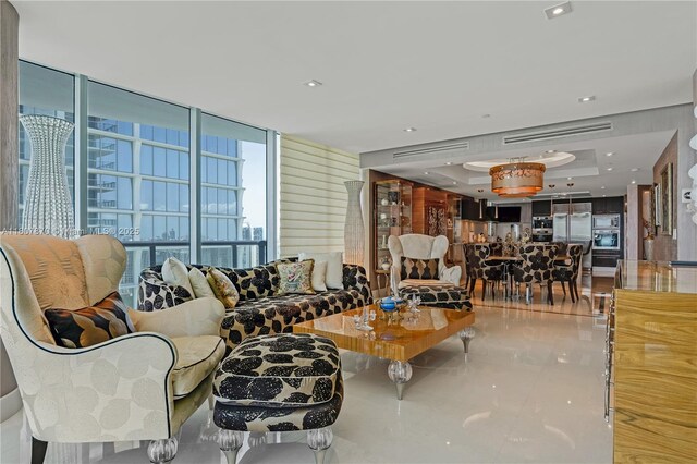 17001 Collins Ave Unit 2501, Sunny Isles Beach, FL 33160 - tiled living room featuring a raised ceiling and floor to ceiling windows