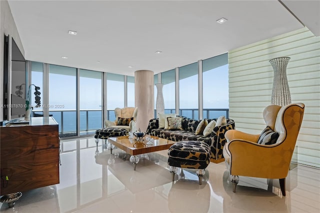 17001 Collins Ave Unit 2501, Sunny Isles Beach, FL 33160 - living area featuring expansive windows, a water view, and tile patterned flooring
