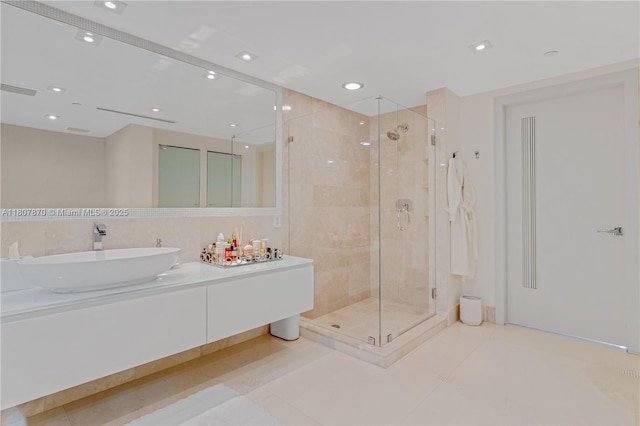 17001 Collins Ave Unit 2501, Sunny Isles Beach, FL 33160 - bathroom featuring a shower stall, vanity, tile patterned flooring, and recessed lighting