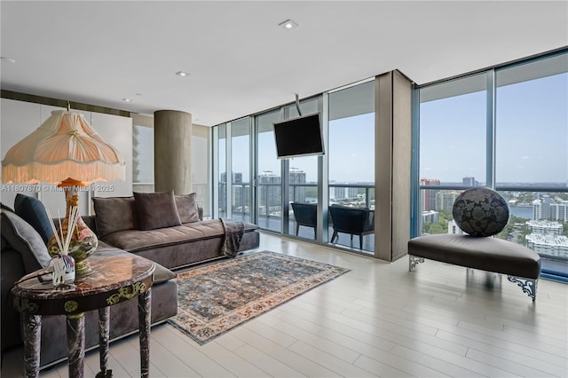 17001 Collins Ave Unit 2501, Sunny Isles Beach, FL 33160 - living room featuring floor to ceiling windows, plenty of natural light, and wood finished floors