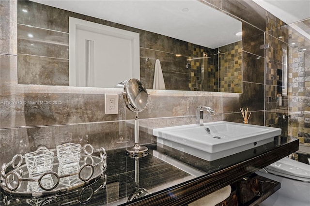 17001 Collins Ave Unit 2501, Sunny Isles Beach, FL 33160 - full bath with tile walls, toilet, a sink, and decorative backsplash