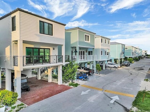 94825 Overseas, Key Largo, FL 33037 - view of property with a residential view, stairs, and a carport
