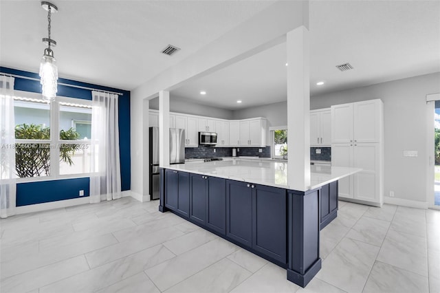 9192 Picot Ct, Boynton Beach, FL 33472 - kitchen with appliances with stainless steel finishes, light marble finish flooring, baseboards, white cabinetry, and recessed lighting