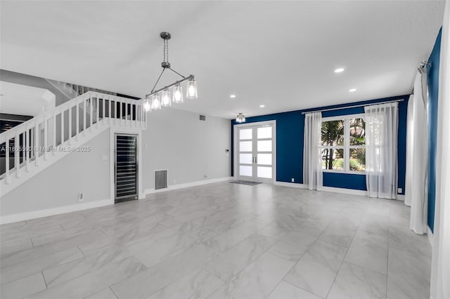 9192 Picot Ct, Boynton Beach, FL 33472 - unfurnished living room featuring stairway, recessed lighting, marble look tile flooring, french doors, and baseboards