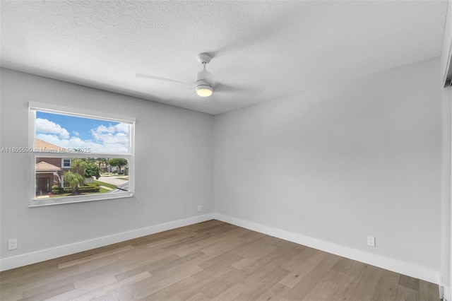 9192 Picot Ct, Boynton Beach, FL 33472 - empty room featuring wood finished floors, a ceiling fan, baseboards, and a textured ceiling
