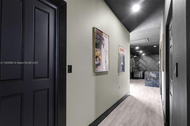 9192 Picot Ct, Boynton Beach, FL 33472 - hallway featuring wood finished floors, baseboards, and attic access
