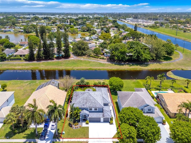 9192 Picot Ct, Boynton Beach, FL 33472 - aerial view of residential area with property parcel outlined and a large body of water