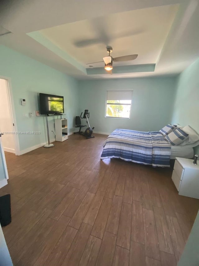 3406 W 88th St, Hialeah, FL 33018 - bedroom featuring a raised ceiling, wood finished floors, and baseboards