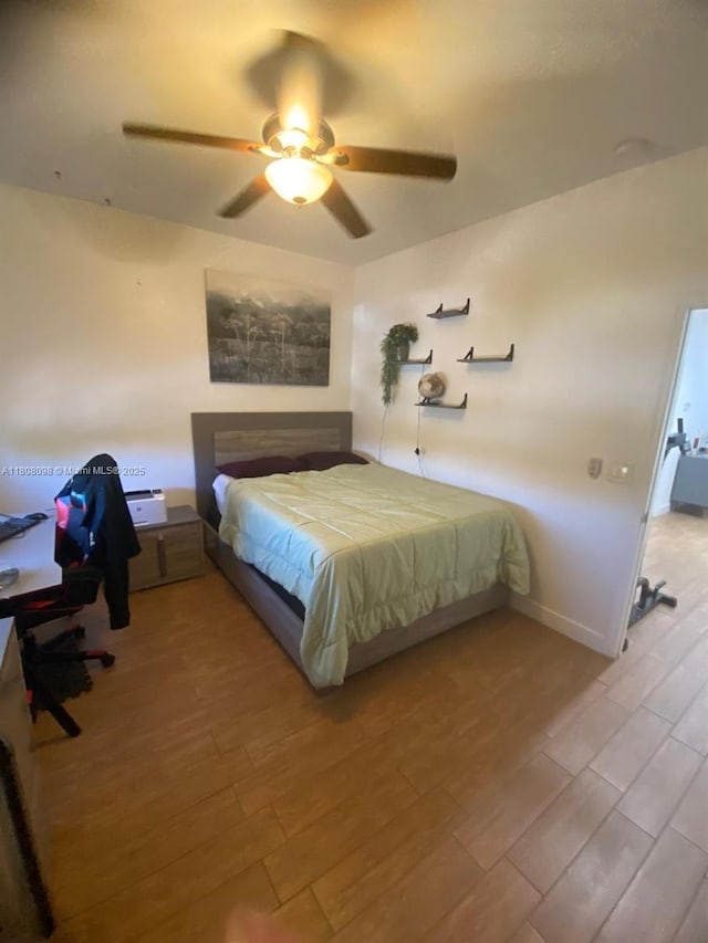 3406 W 88th St, Hialeah, FL 33018 - bedroom featuring wood finished floors, a ceiling fan, and baseboards