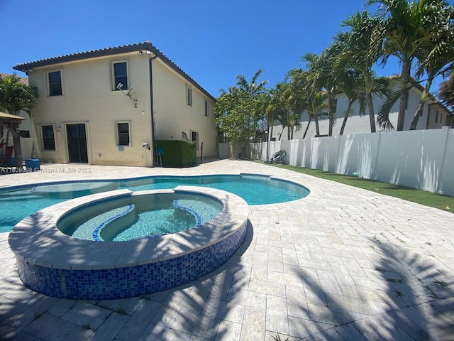 3406 W 88th St, Hialeah, FL 33018 - view of swimming pool with a patio area, a fenced backyard, and a pool with connected hot tub