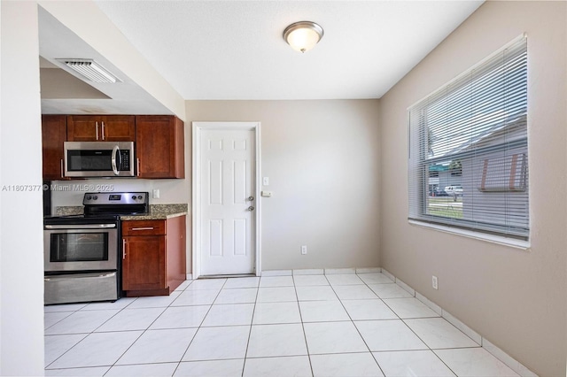 2240 NW 47th Ter, Lauderhill, FL 33313 - kitchen featuring stainless steel appliances and light stone counters