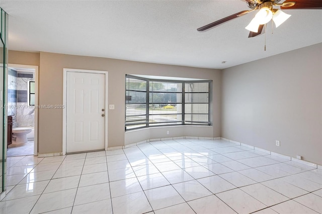 2240 NW 47th Ter, Lauderhill, FL 33313 - empty room with light tile patterned floors and ceiling fan
