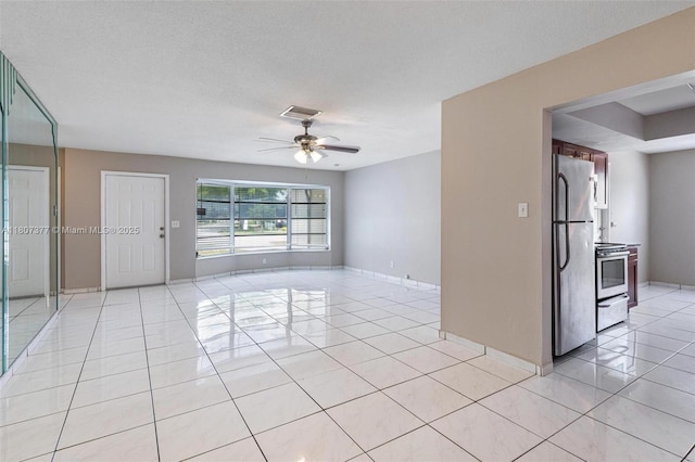 2240 NW 47th Ter, Lauderhill, FL 33313 - empty room with ceiling fan, light tile patterned floors, and baseboards