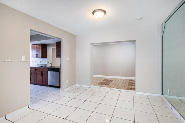 2240 NW 47th Ter, Lauderhill, FL 33313 - kitchen with dishwasher, light tile patterned floors, a sink, and baseboards