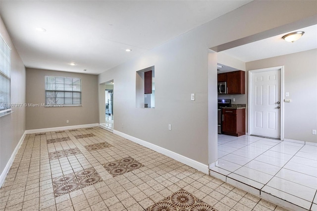 2240 NW 47th Ter, Lauderhill, FL 33313 - spare room with light tile patterned floors, baseboards, and recessed lighting